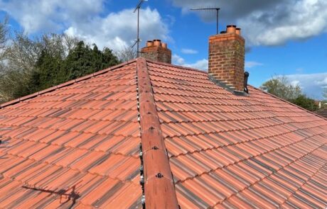 Close-up view of newly laid interlocking clay tiles featuring modern dry verge systems on a detached home in Morpeth.